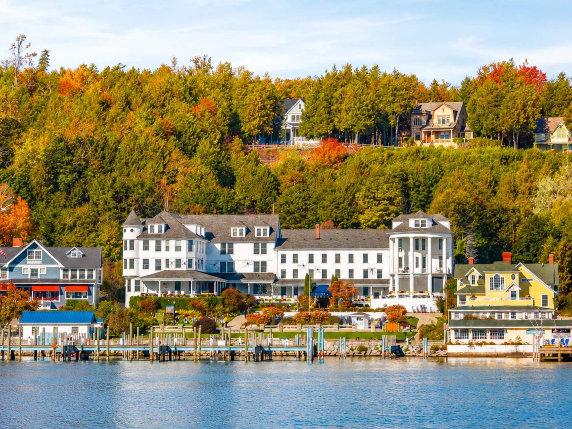 Island House Hotel with fall colors around it on Mackinac Island.